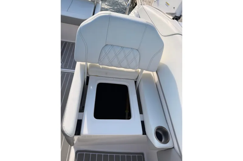 Slide: The Image of 2022 Regal 26 XO boat seat with storage compartment and cup holder. - 10