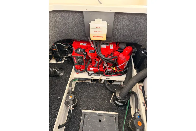 Slide: The Image of Engine compartment of 2022 Regal 26 XO boat with visible Westerbeke components. - 19