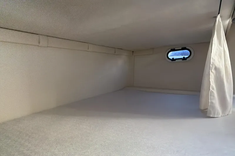 Slide: The Image of Interior cabin of 2022 Regal 26 XO boat with window and curtain. - 28