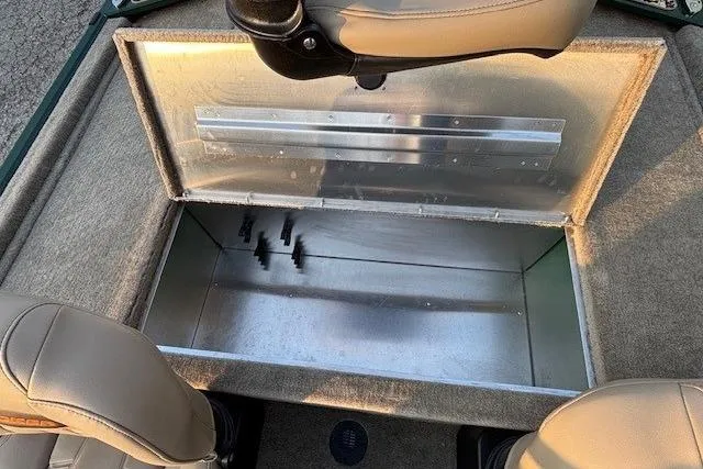 Slide: The Image of 2026 Tracker Bass Tracker Classic Limited boat storage compartment with open lid and seating. - 15