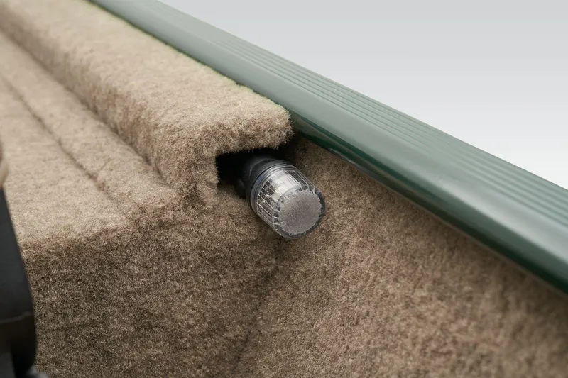 Slide: The Image of Manufacturer Provided Image: 2026 Tracker Bass Tracker Classic Limited boat detail with carpeted interior and light fixture. - 29