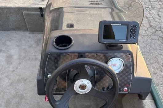 Slide: The Image of Steering console of 2026 Tracker Bass Tracker Classic Limited with fishfinder and gauge. - 9