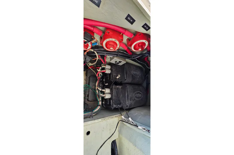 Slide: The Image of Electrical system of a 2004 Leopard 47 boat, featuring wiring and battery components. - 11
