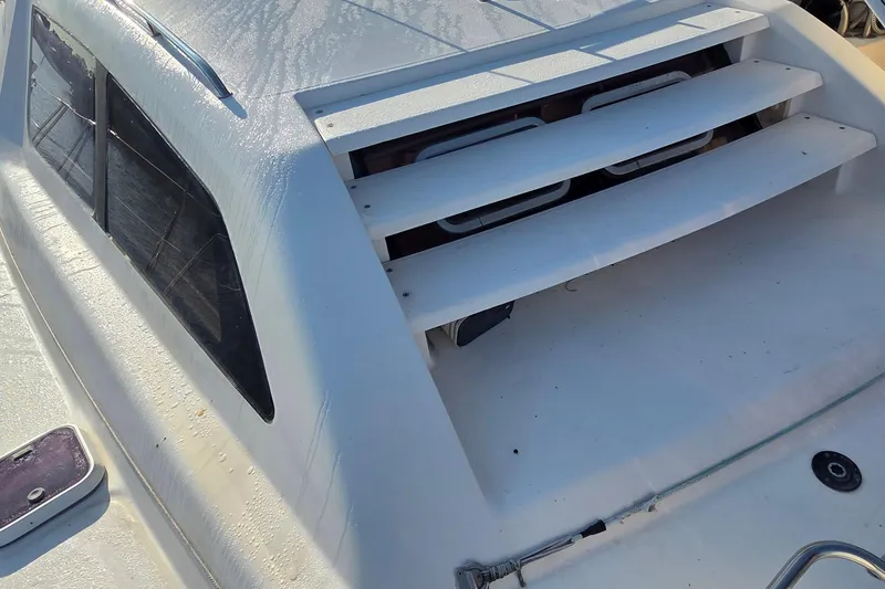 Slide: The Image of 2004 Leopard 47 yacht deck with ventilation slats and windows. - 24