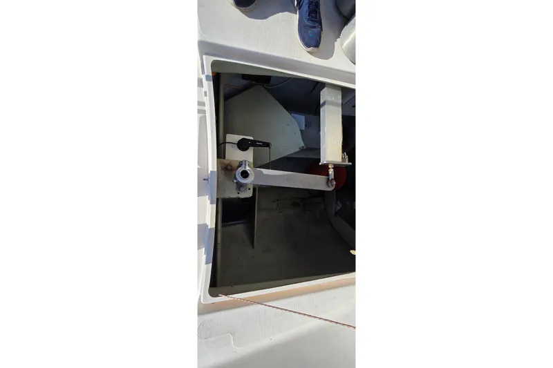 Slide: The Image of Open hatch of a 2004 Leopard 47 catamaran, showing interior mechanical components. - 34