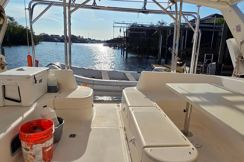 Slide: The Image of Leopard 47 catamaran interior with dock view, 2004 model, sunny waterfront setting. - 44