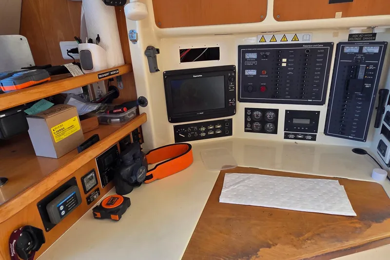 Slide: The Image of Control panel of a 2004 Leopard 47 yacht with navigation and communication equipment. - 45