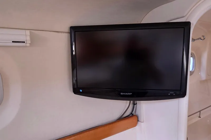 Slide: The Image of Flat-screen TV mounted inside a 2004 Leopard 47 yacht interior. - 53