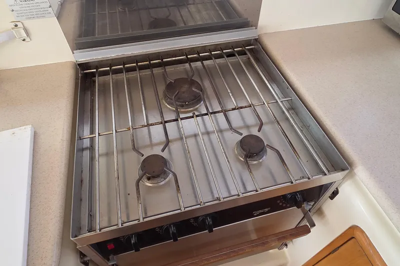 Slide: The Image of Three-burner gas stove in a 2004 Leopard 47 yacht kitchen. - 66