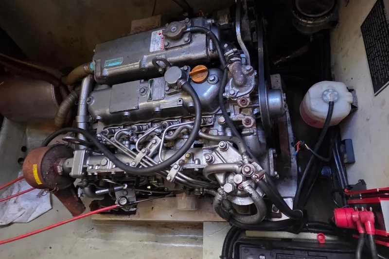 Slide: The Image of Engine compartment of a 2004 Leopard 47 catamaran, showcasing intricate mechanical components. - 69