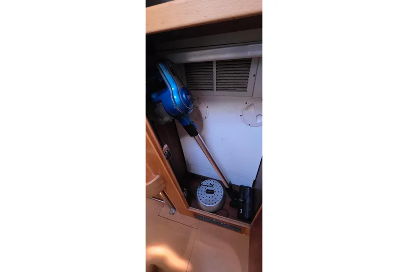 Slide: The Image of Storage compartment in a 2004 Leopard 47 yacht with cleaning equipment. - 72