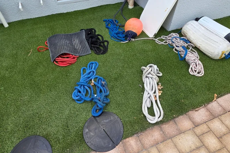 Slide: The Image of Assorted ropes and boating gear on artificial grass, Leopard 47, 2004 model. - 78