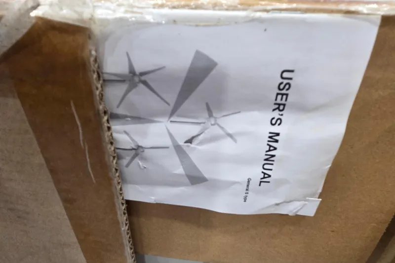 Slide: The Image of User manual for Leopard 47, 2004 model, partially visible in cardboard packaging. - 84