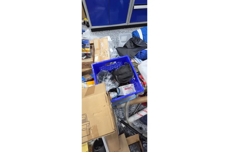 Slide: The Image of Messy workshop with tools, boxes, and supplies for Leopard 47, 2004 model. - 94