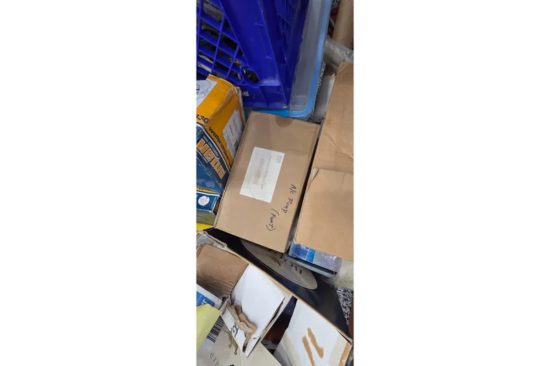 Slide: The Image of Boxes and crates stacked, labeled "Leopard 47," model year 2004. - 96