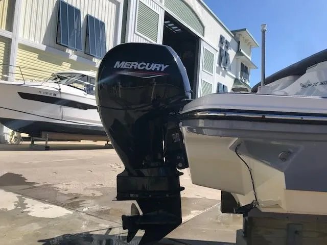 Slide: The Image of 2022 Sea Ray SPX 190 OB with Mercury outboard motor in marina setting. - 12