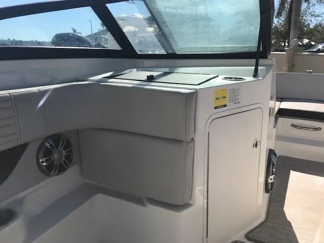 Slide: The Image of 2022 Sea Ray SPX 190 OB boat interior with seating and storage. - 23