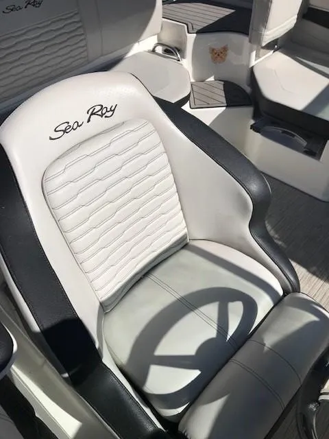 Slide: The Image of 2022 Sea Ray SPX 190 OB boat seat with logo, white and black design. - 30