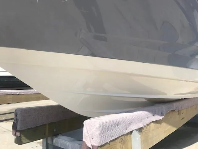 Slide: The Image of 2022 Sea Ray SPX 190 boat hull on a wooden stand. - 8