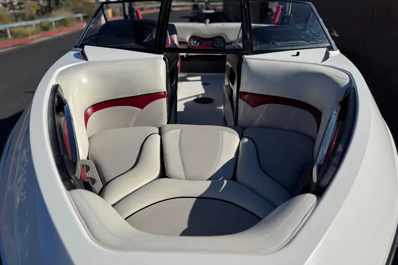 Slide: The Image of 2012 Malibu Wakesetter 21 VLX boat interior with white and red seating. - 12