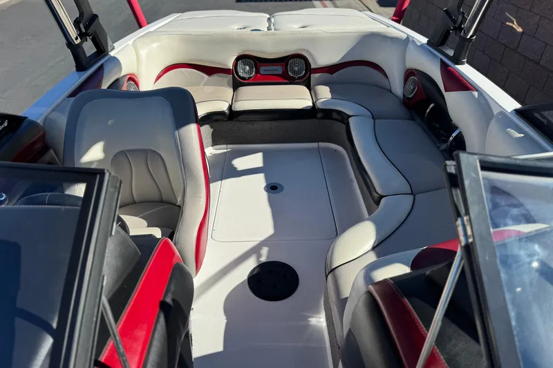 Slide: The Image of Interior of 2012 Malibu Wakesetter 21 VLX boat with gray and red seating. - 16