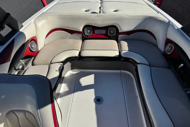 Slide: The Image of 2012 Malibu Wakesetter 21 VLX boat interior with cushioned seating and speakers. - 17