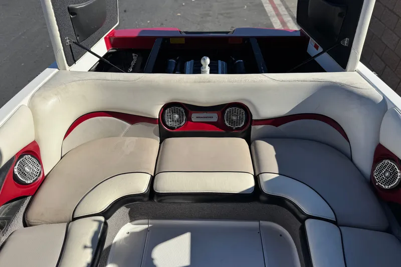 Slide: The Image of 2012 Malibu Wakesetter 21 VLX boat interior with red and white seating. - 18