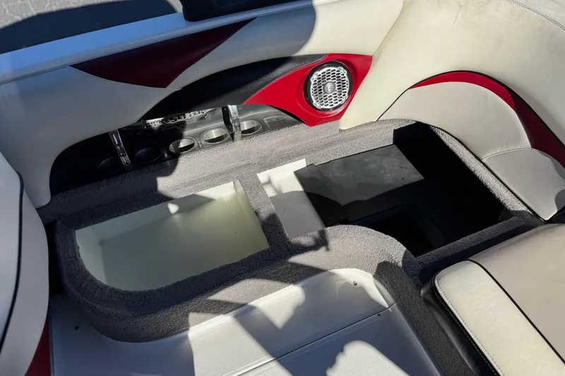 Slide: The Image of 2012 Malibu Wakesetter 21 VLX interior with speaker and storage compartments. - 21