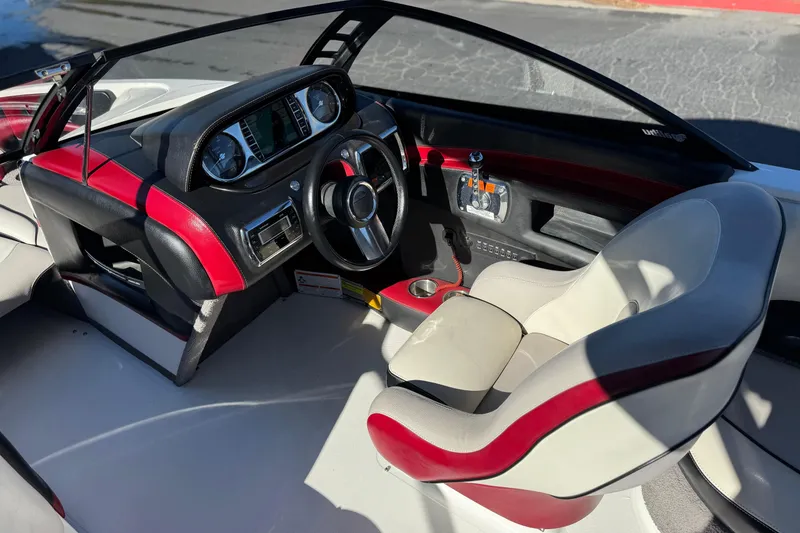 Slide: The Image of Interior of 2012 Malibu Wakesetter 21 VLX boat with sleek dashboard and steering wheel. - 24