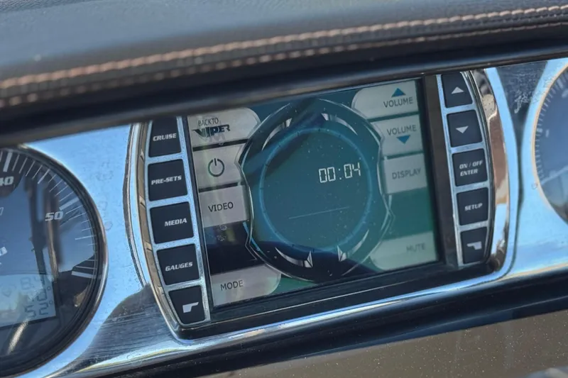 Slide: The Image of Dashboard of 2012 Malibu Wakesetter 21 VLX with digital display and controls. - 26