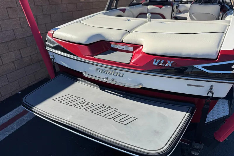 Slide: The Image of 2012 Malibu Wakesetter 21 VLX boat with red and white upholstery, rear view. - 6