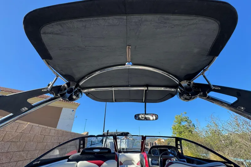 Slide: The Image of 2012 Malibu Wakesetter 21 VLX boat interior with speakers and canopy. - 9