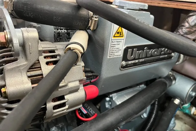 Slide: The Image of Close-up of a Universal engine in a 2003 Catalina 30 sailboat. - 11