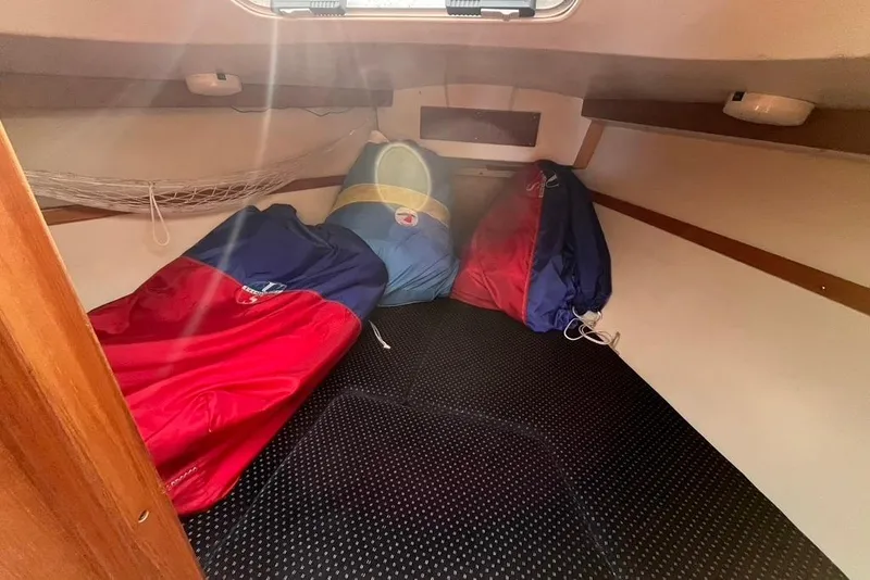 Slide: The Image of Cozy interior cabin of 2003 Catalina 30 sailboat with colorful sleeping bags. - 4