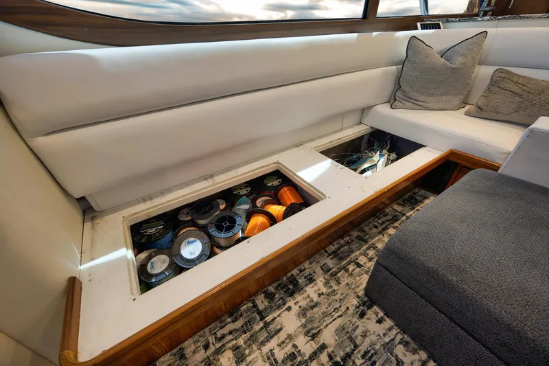 Slide: The Image of Luxurious 2004 Guthrie 60 Custom Carolina yacht interior with hidden storage under seating. - 10