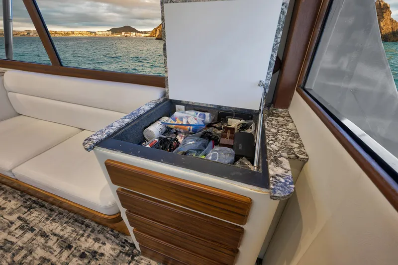Slide: The Image of Interior of 2004 Guthrie 60 Custom Carolina yacht with open storage compartment. - 13