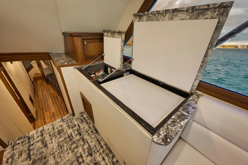 Slide: The Image of Interior of 2004 Guthrie 60 Custom Carolina yacht with open storage compartment. - 15