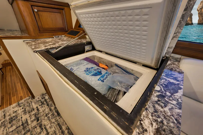 Slide: The Image of Open cooler on 2004 Guthrie 60 Custom Carolina boat with ice packs inside. - 16