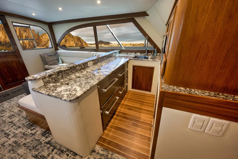 Slide: The Image of Luxurious interior of 2004 Guthrie 60 Custom Carolina yacht with elegant wood and granite finishes. - 18