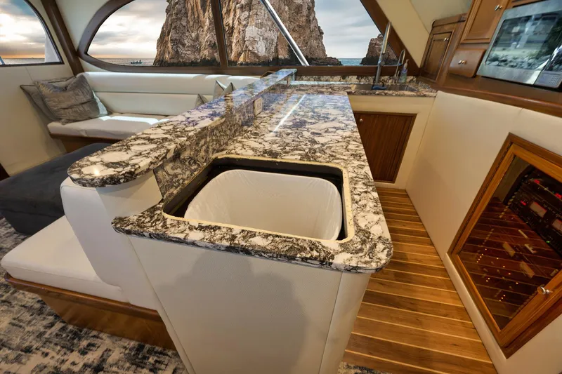 Slide: The Image of Luxurious 2004 Guthrie 60 Custom Carolina yacht interior with marble countertops and scenic window view. - 23