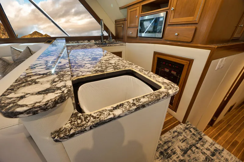 Slide: The Image of Luxurious 2004 Guthrie 60 Custom Carolina yacht interior with granite countertops and modern kitchen amenities. - 24