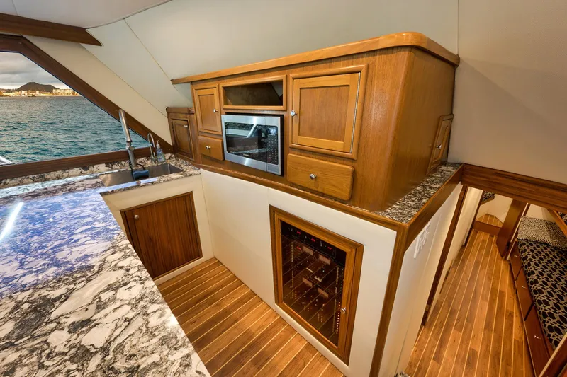 Slide: The Image of Luxurious 2004 Guthrie 60 Custom Carolina yacht interior with modern kitchen and ocean view. - 25