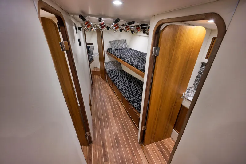 Slide: The Image of Interior of 2004 Guthrie 60 Custom Carolina yacht with wooden flooring and bunk beds. - 27