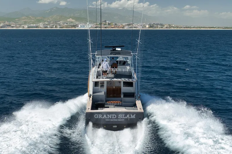 Slide: The Image of 2004 Guthrie 60 Custom Carolina yacht cruising on open sea near coastline. - 3