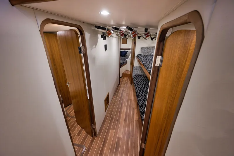 Slide: The Image of Interior of 2004 Guthrie 60 Custom Carolina yacht with wooden doors and bunk beds. - 30