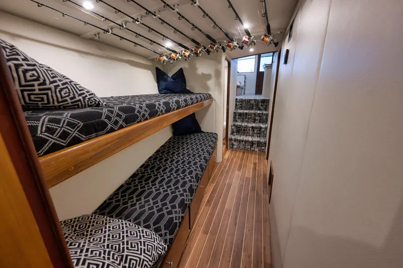 Slide: The Image of Interior of 2004 Guthrie 60 Custom Carolina yacht with bunk beds and fishing rods. - 33