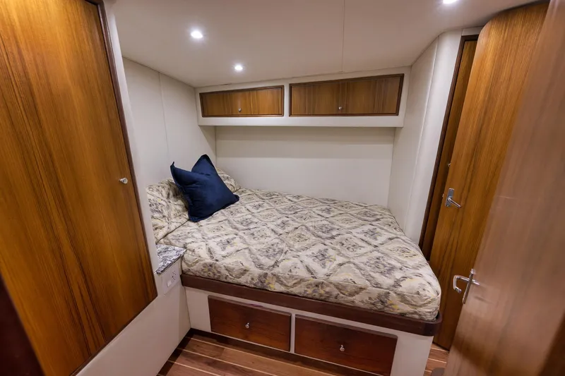 Slide: The Image of Cozy cabin interior of 2004 Guthrie 60 Custom Carolina yacht with wood accents and bedding. - 35
