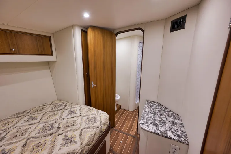 Slide: The Image of Interior of 2004 Guthrie 60 Custom Carolina yacht cabin with bed and bathroom. - 36