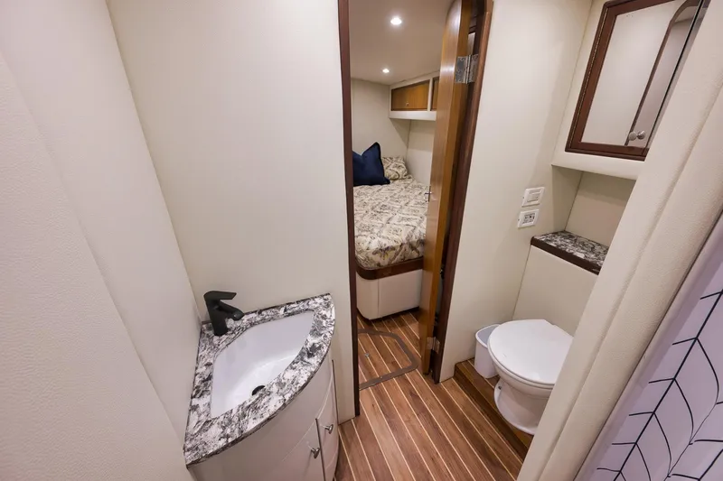 Slide: The Image of Luxurious 2004 Guthrie 60 Custom Carolina yacht interior with bedroom and bathroom. - 37