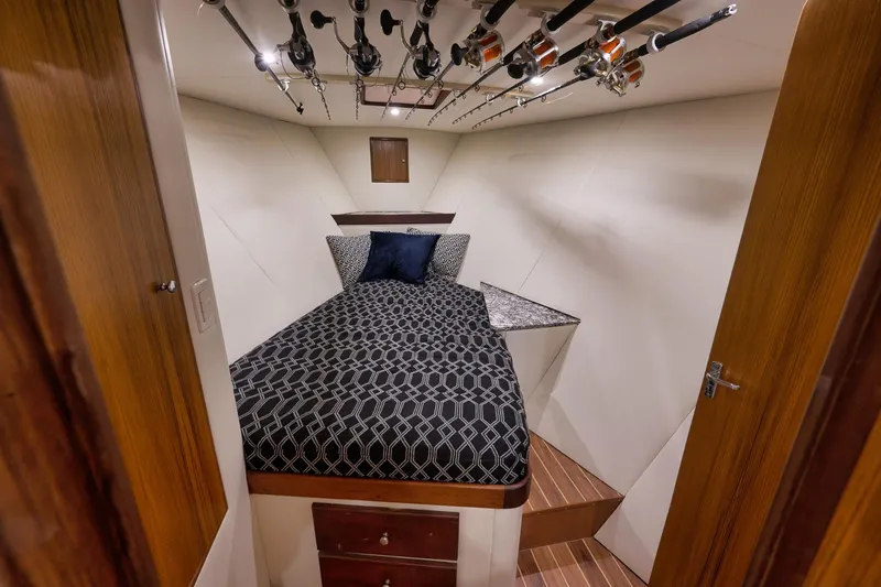 Slide: The Image of Luxurious cabin interior of 2004 Guthrie 60 Custom Carolina boat with fishing rods. - 39